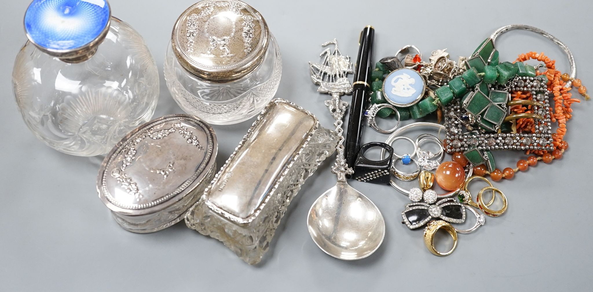 A silver and enamel mounted glass scent bottle(a.f.), three silver mounted glass toilet jars and aassorted jewellery including silver.